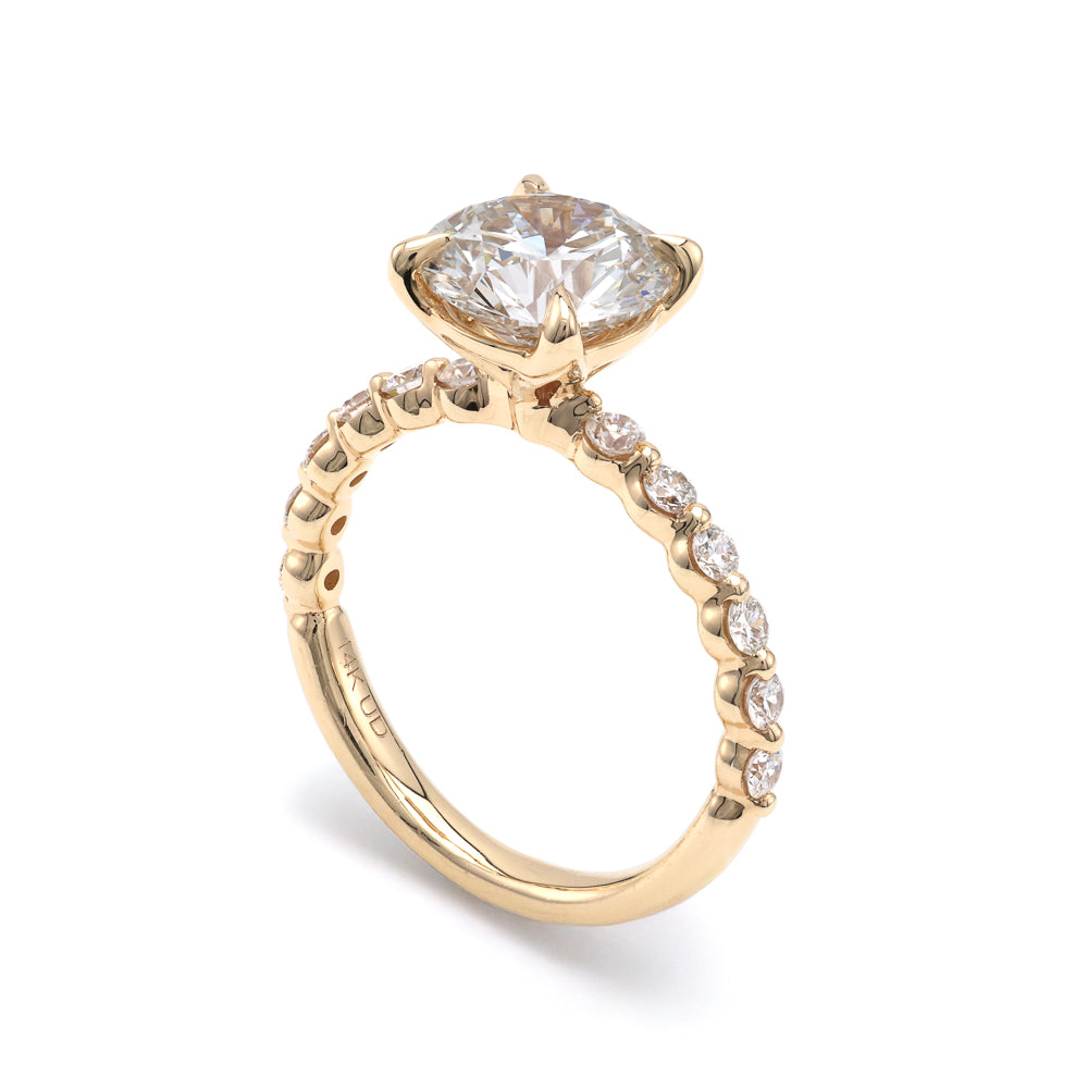 Yellow gold ring with round diamonds.