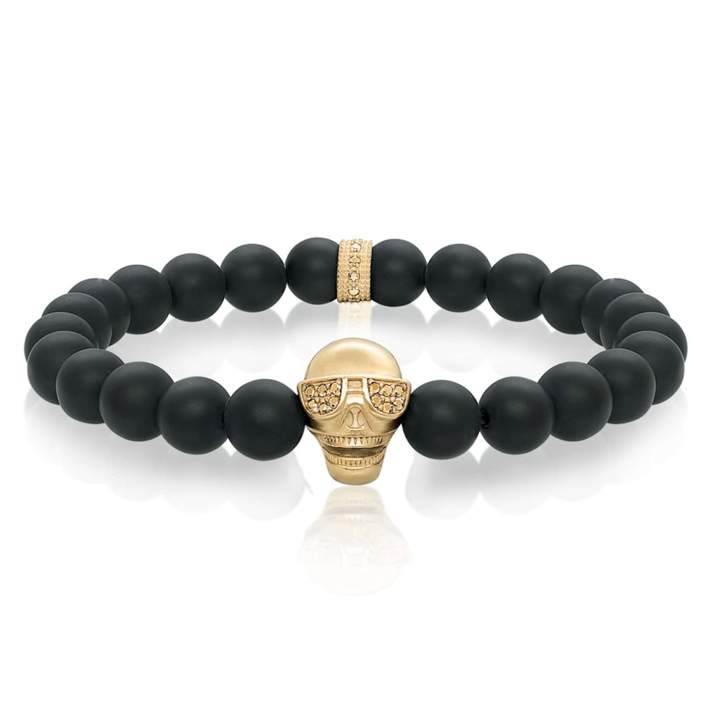 Black Onyx bracelet with gold skull accent.