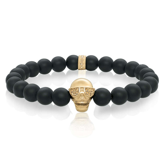 Black Onyx bracelet with gold skull accent.