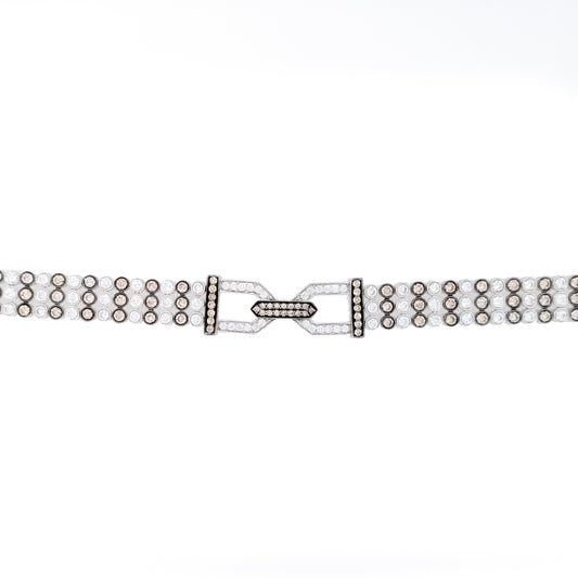 Diamond bracelet with geometric clasp design.