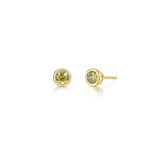 Gold bezel-set yellow gemstone stud earrings.