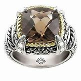 Cushion-cut Smokey Quartz ring with diamond accents.