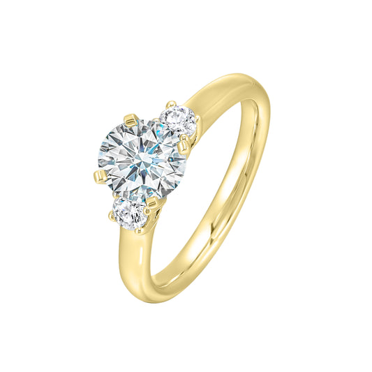 Three-stone diamond ring in yellow gold.