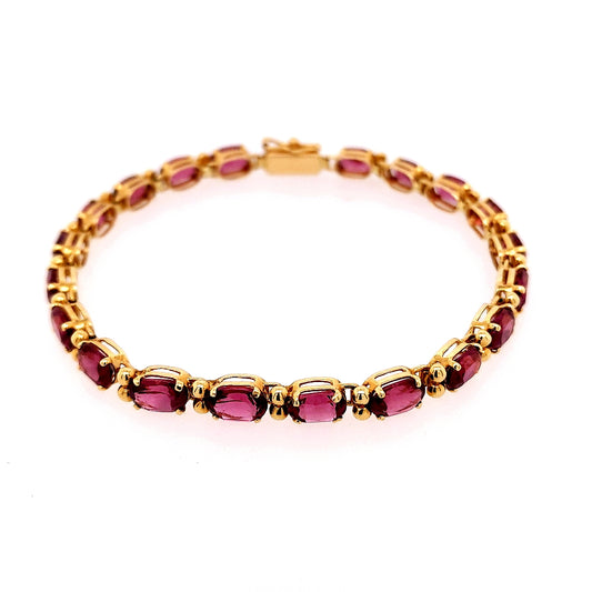 Oval Rhodolite Garnet bracelet in yellow gold.
