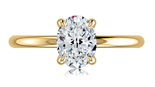 Yellow gold ring with oval diamond centerpiece.