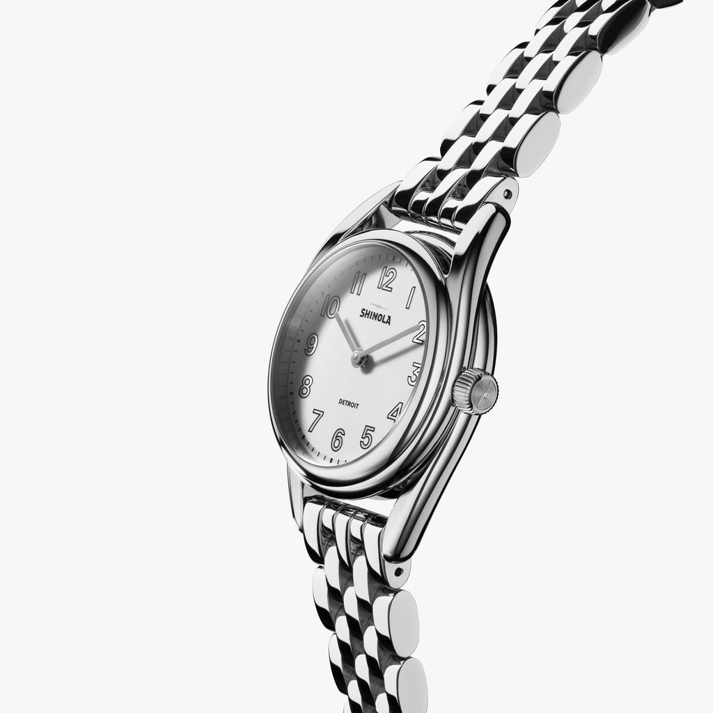 Shinola stainless steel watch with white dial.