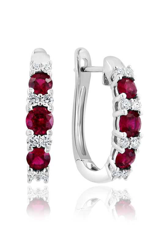 Small white gold hoop earrings with rubies.