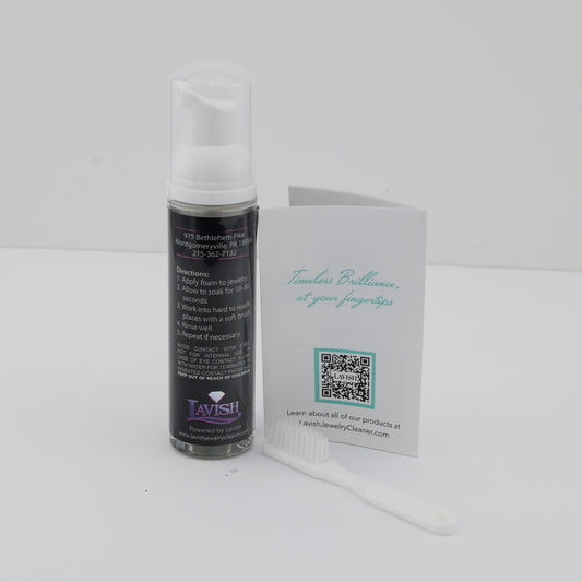 Foaming jewelry cleaner with brush and instructions.