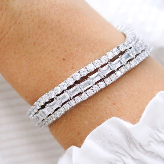 Sterling silver bracelet with emerald-cut zirconia.