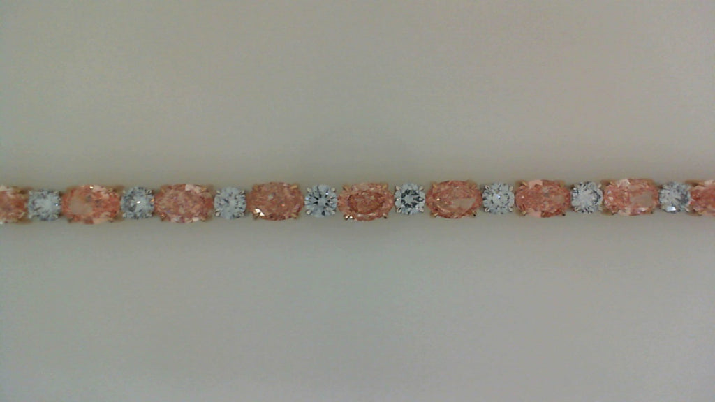 Round and oval diamonds in white rose gold.
