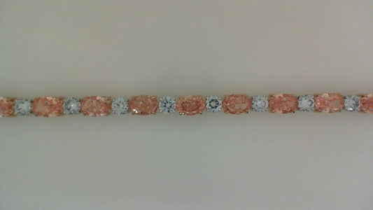 Round and oval diamonds in white rose gold.