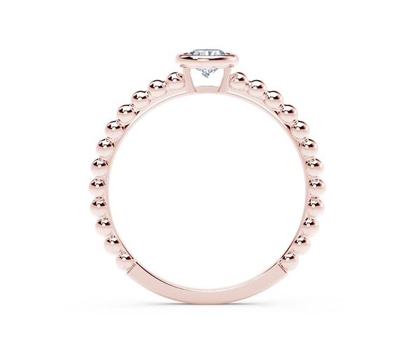 Rose gold ring with round diamond accent.