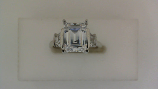 White gold ring with three trapezoid diamonds.