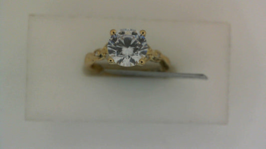 Yellow gold ring with round diamond centerpiece.