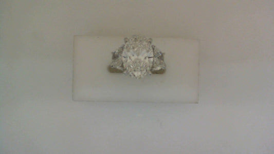 Three-stone white gold engagement ring.