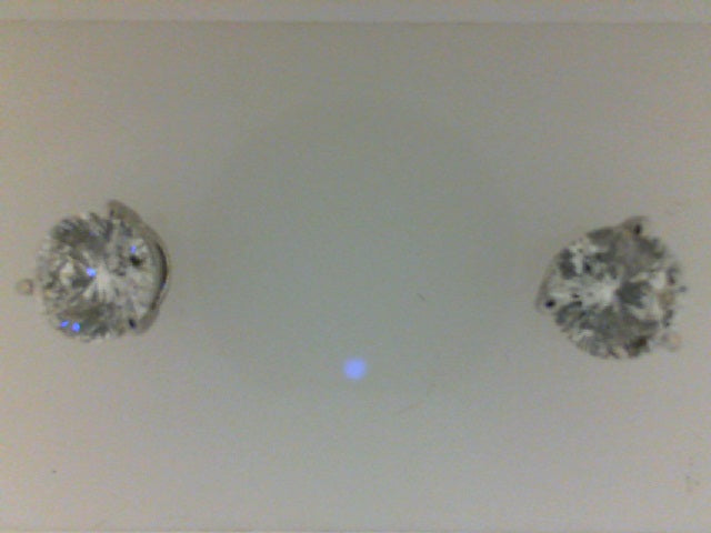 14K white gold diamond stud earrings.