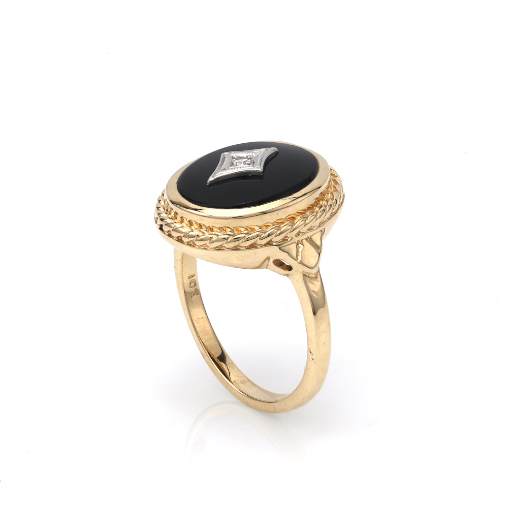 Cabochon onyx ring with diamond accent.