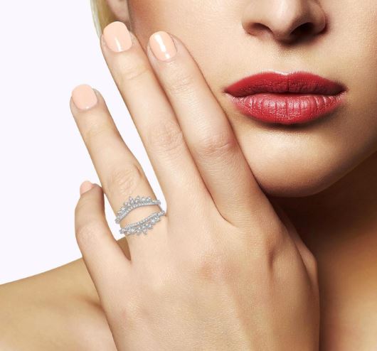 Diamond enhancer band with round stones.