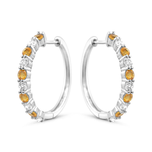 Sterling silver hoops with citrines and sapphires.