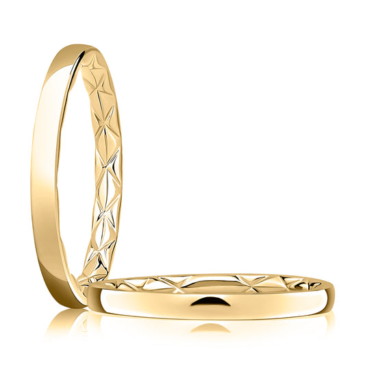 Carved star pattern 14K yellow gold band.