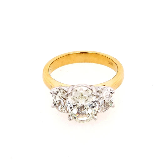 Three Stone Natural Diamond Complete Engagement Ring in 18 Karat Yellow with 1.70ctw J VVS1 Oval Diamond