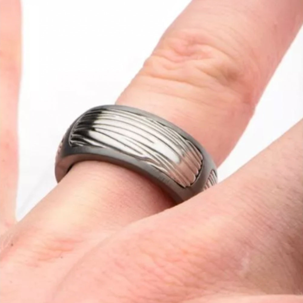 Stainless steel black-grey textured ring.