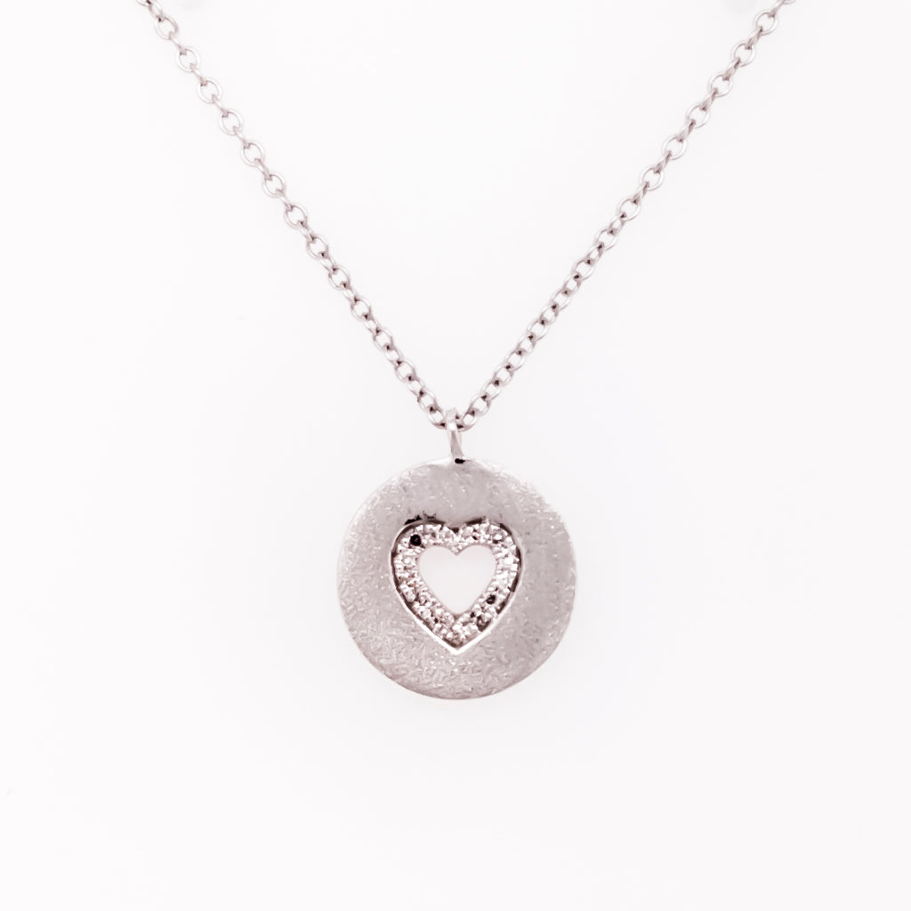 Heart-shaped diamond pendant, white gold necklace.