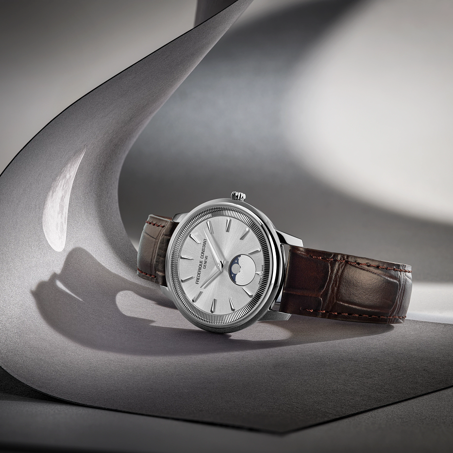 Silver dial watch with moon phase display.
