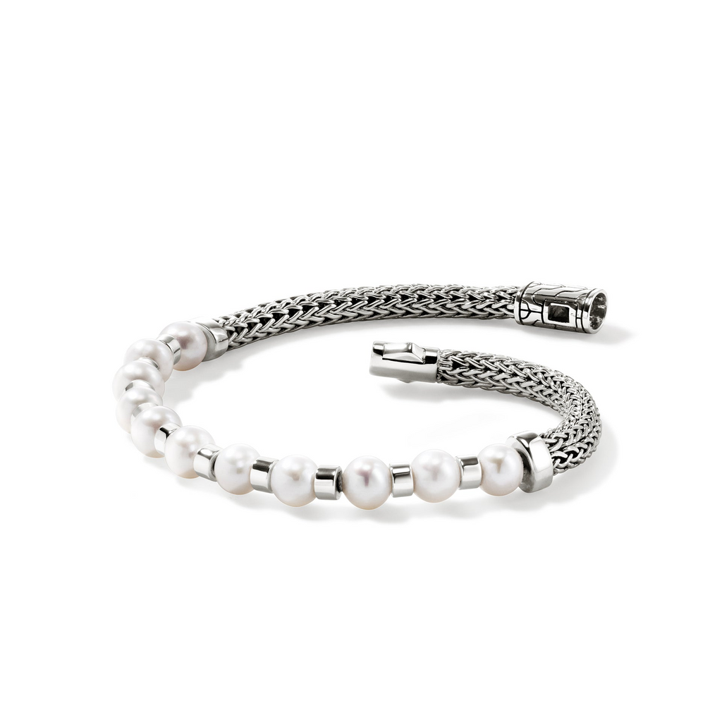 Sterling silver bracelet with cultured pearls.