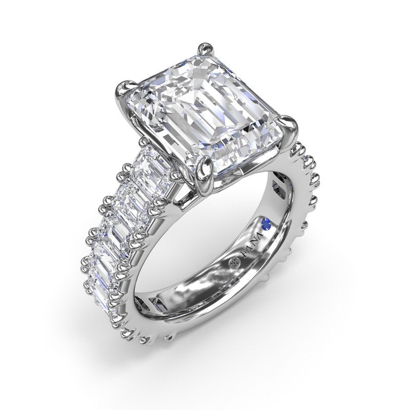 Emerald-cut diamond ring in white gold.