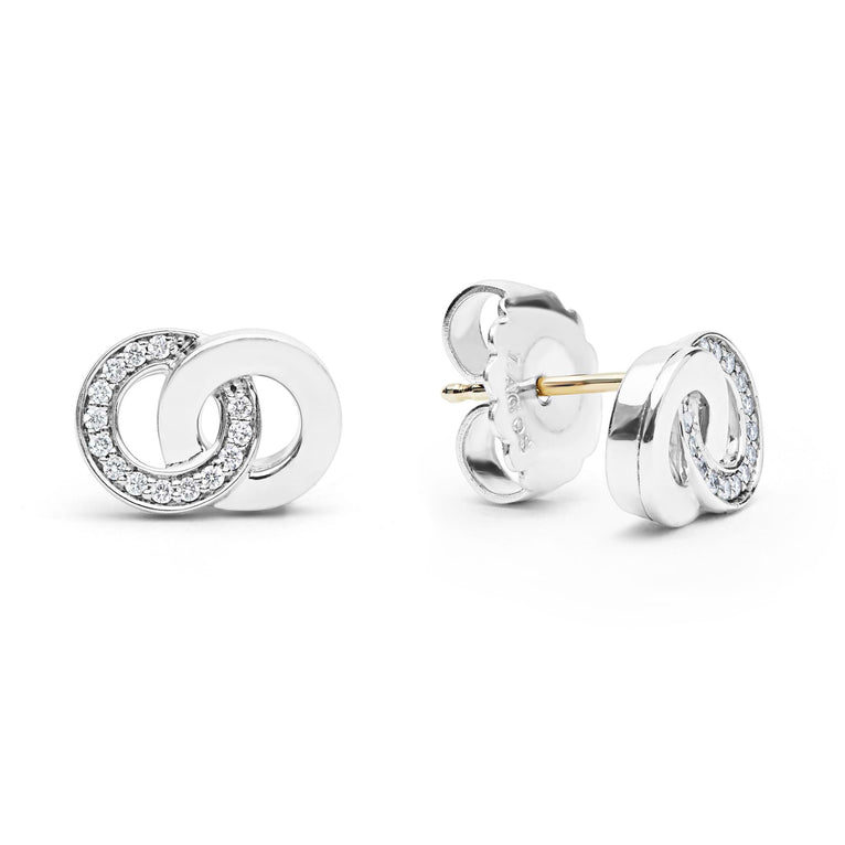 Sterling silver diamond interlocking circle earrings.