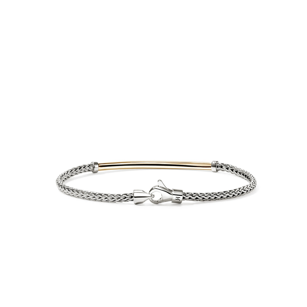 Sterling silver bracelet with yellow gold accent.
