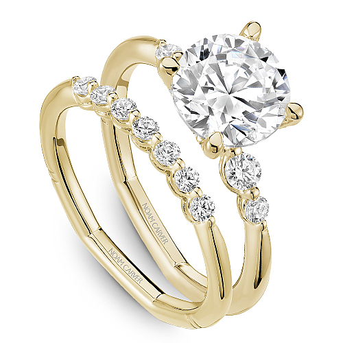 Yellow gold ring with round diamonds.