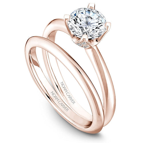 Rose gold ring with solitaire diamond.