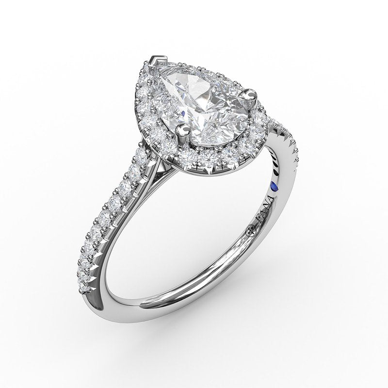 Pear-shaped diamond halo engagement ring.