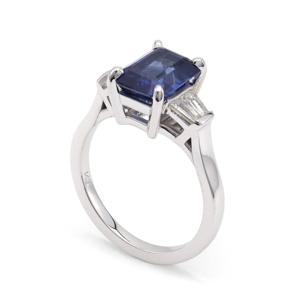 Emerald sapphire ring with baguette diamonds.