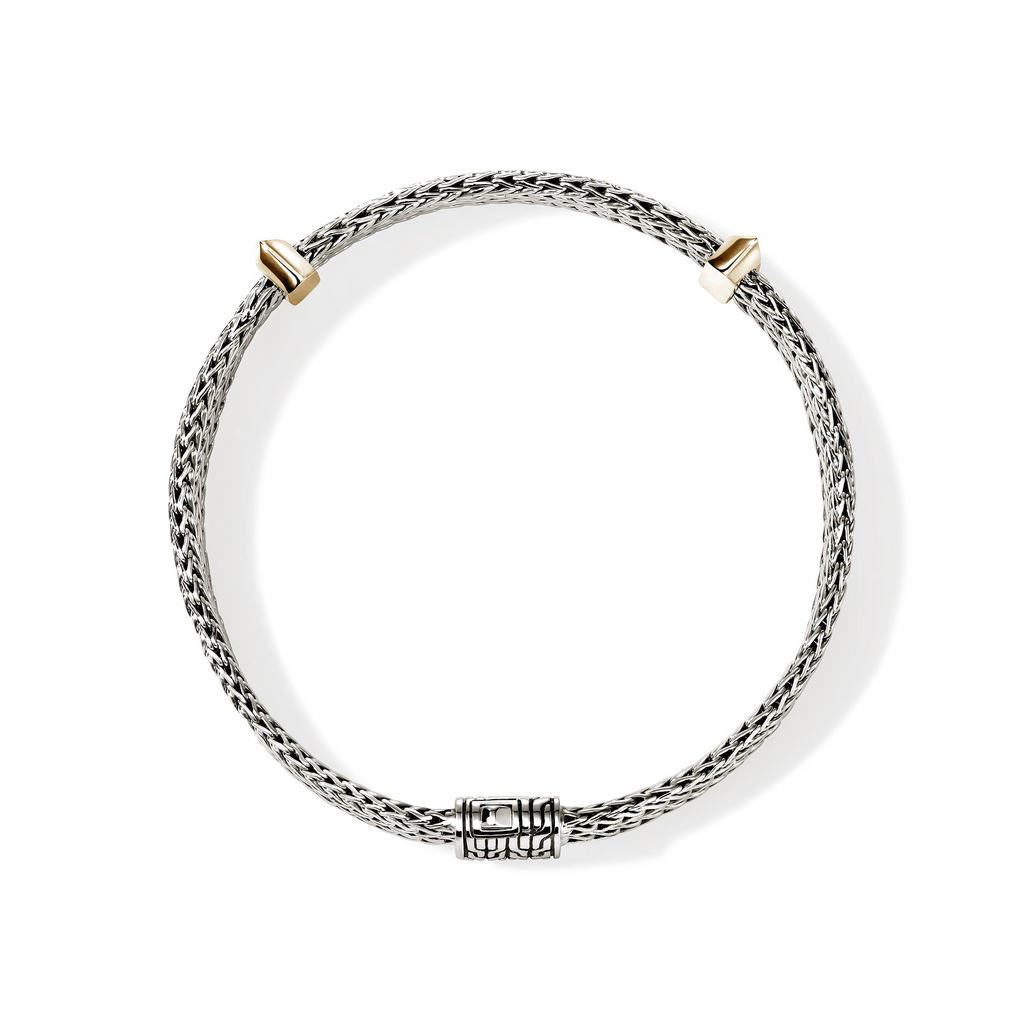 Sterling silver bracelet with yellow gold accents.