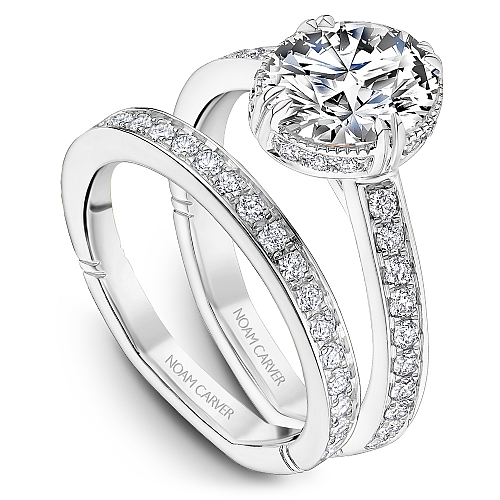 14K white gold diamond halo ring.