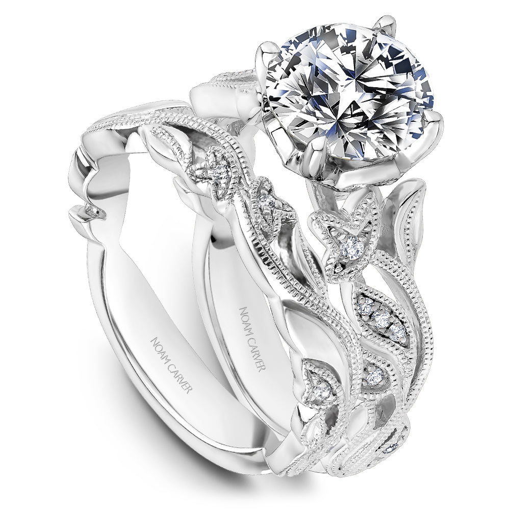 White gold ring with diamond accents.