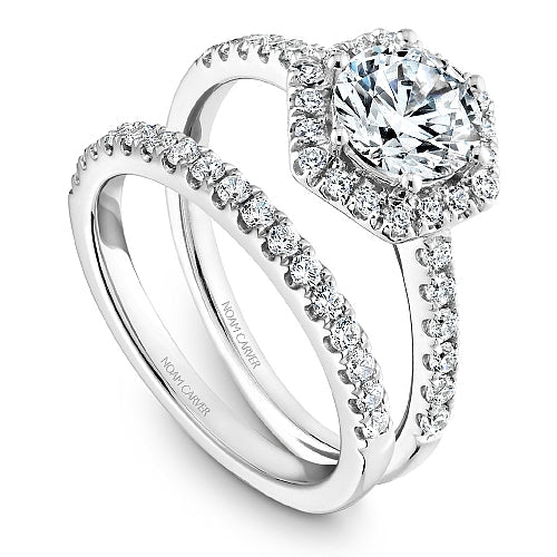 Halo diamond ring in white gold setting.