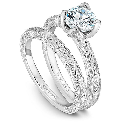 Engraved white gold solitaire engagement ring.