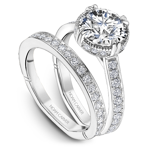 Vintage halo diamond ring in white gold.