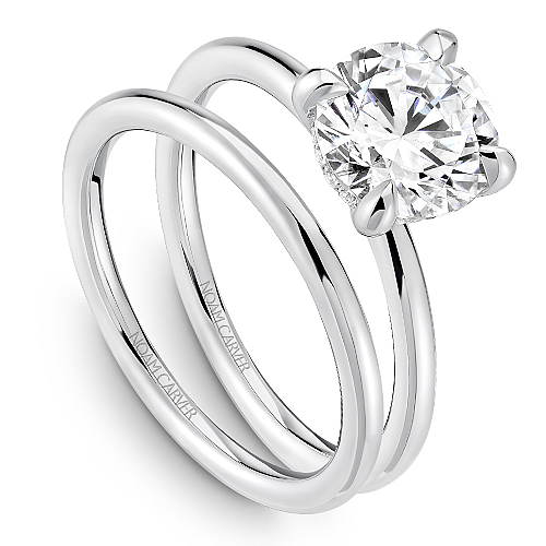 14K white gold ring with hidden diamond accents.