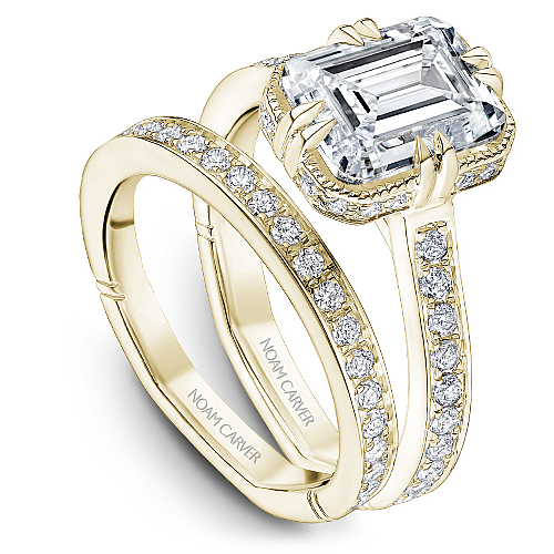 Yellow gold ring with diamond accents.