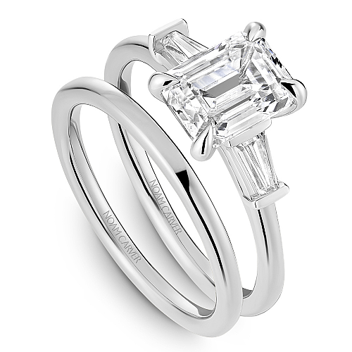 Three-stone diamond ring with baguettes.
