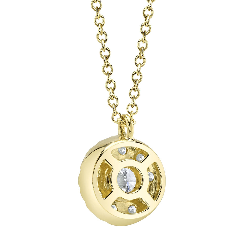 Yellow gold necklace with circular diamond pendant.