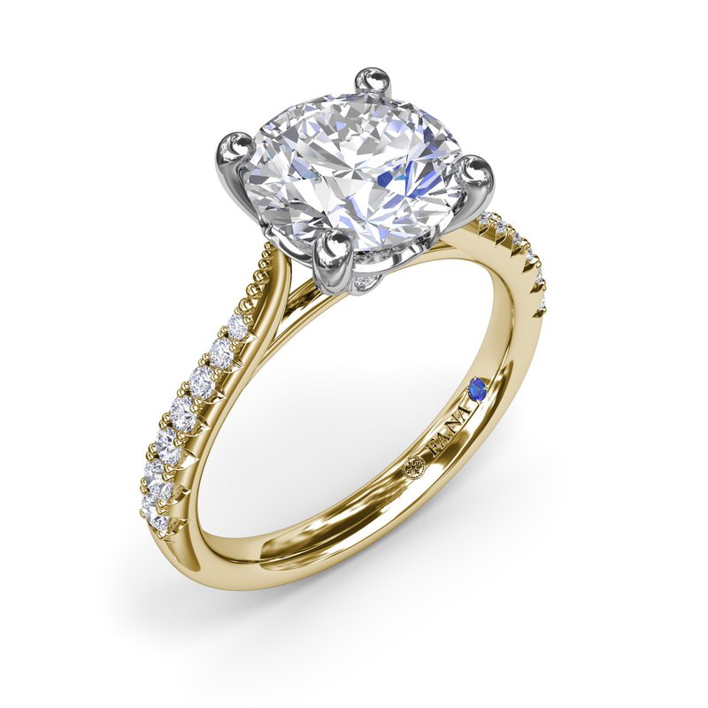 Yellow gold ring with round diamond accents.