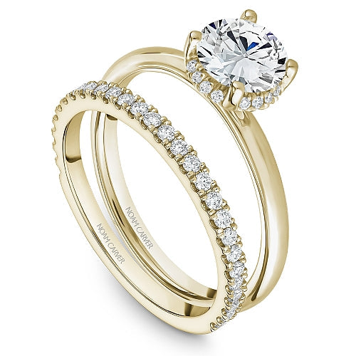 Yellow gold diamond semi-mount engagement ring.