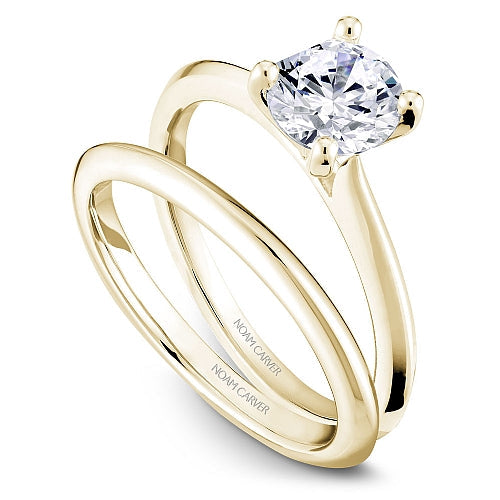 Yellow gold solitaire engagement ring.