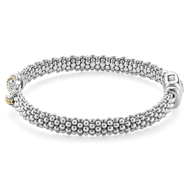 Sterling silver bracelet with 18k gold and round diamonds.